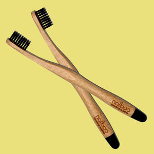2 Natboo Toothbrushes. Black + (another color)